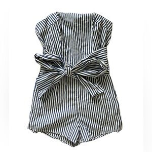 Blue and White striped romper jumpsuit with tie in the front.
